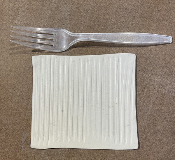A1 Cut a 4-inch square of clay. Smooth each side of the square with a rib, then use the backside of a fork to texture it.