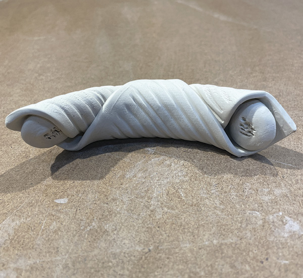 A5 Slip and score the inside of each end of the croissant and both sides of the two disks. Insert the disks into each end.