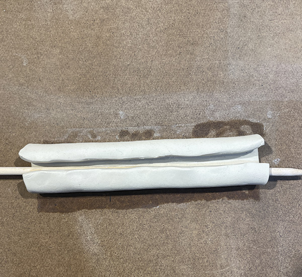 B3 Repeat the same slipping, dowel, and folding process along the other long side of the rectangle.