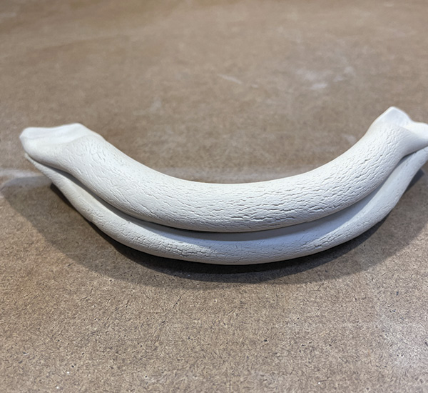B5 Cut the double tube handle to the desired length and squeeze the ends shut, then gently curve the handle.