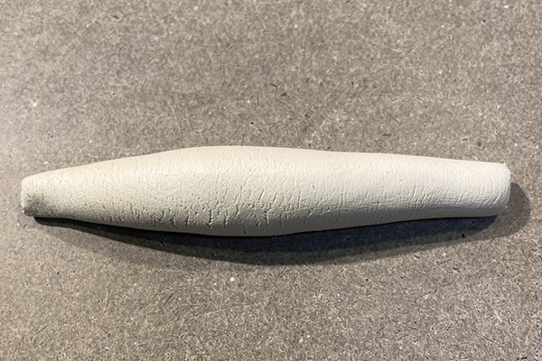 C1 From a smooth ball of clay create a cigar-shaped coil with narrow ends and a fat center.