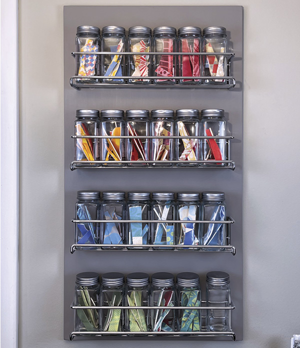 5 Once the board is mounted to the studio wall, fill and arrange the jars with your favorite color combinations.