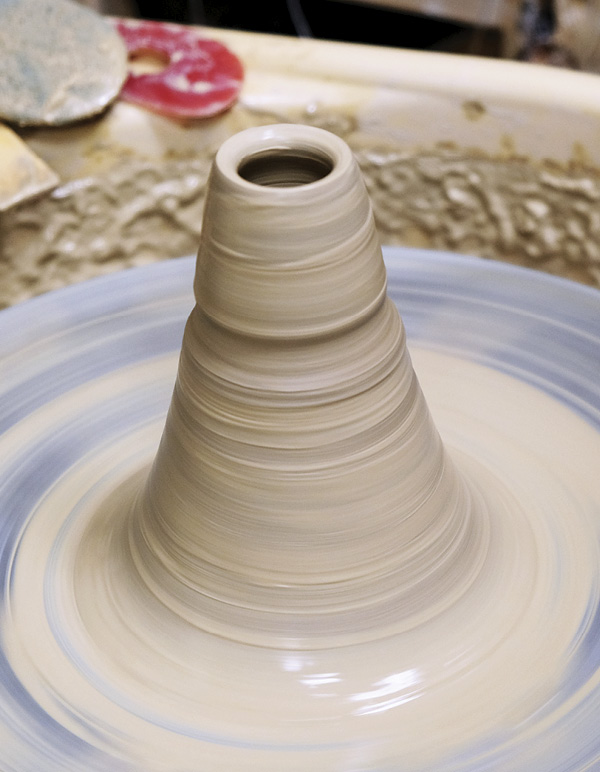 2 To make bird heads, cone up clay and throw small domes off the hump.