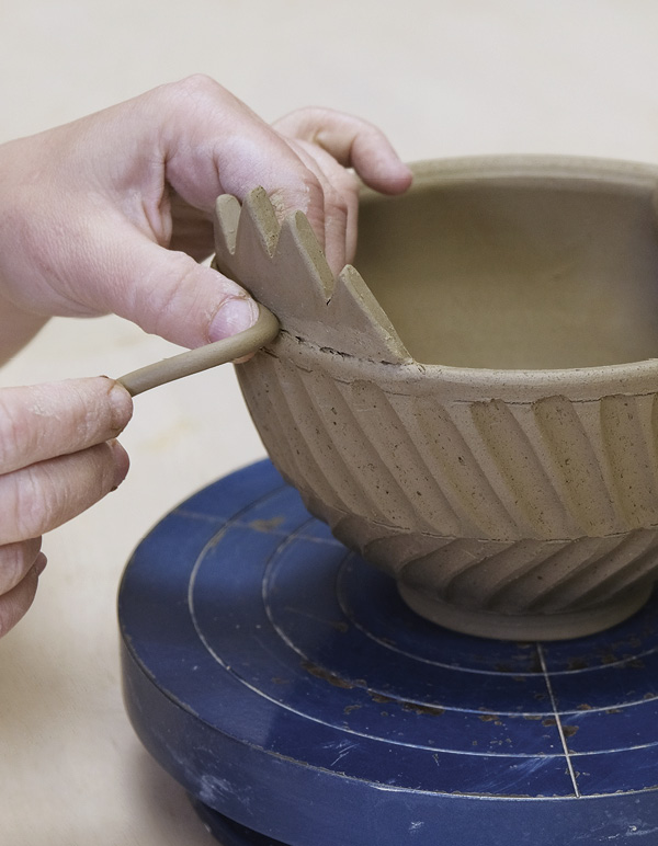 9 Cut a bevel into the edge of the tail feathers, then join them to bowl rim.