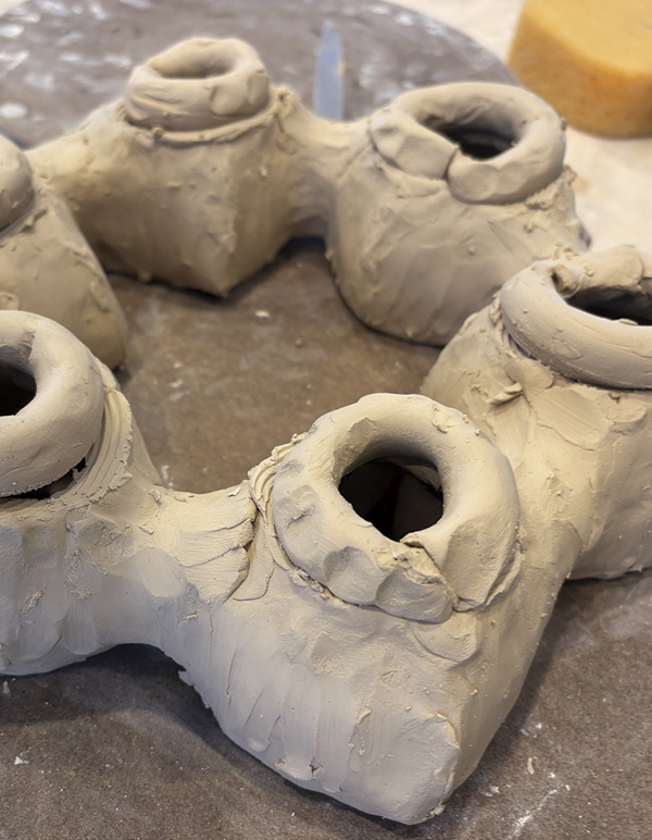 5 Score and slip to add additional coils to increase height of each lobe.