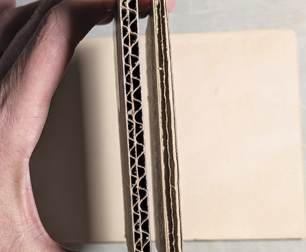 2 Example of different edges on a cardboard square. Left is a wavy cross section and the right has parallel lines.