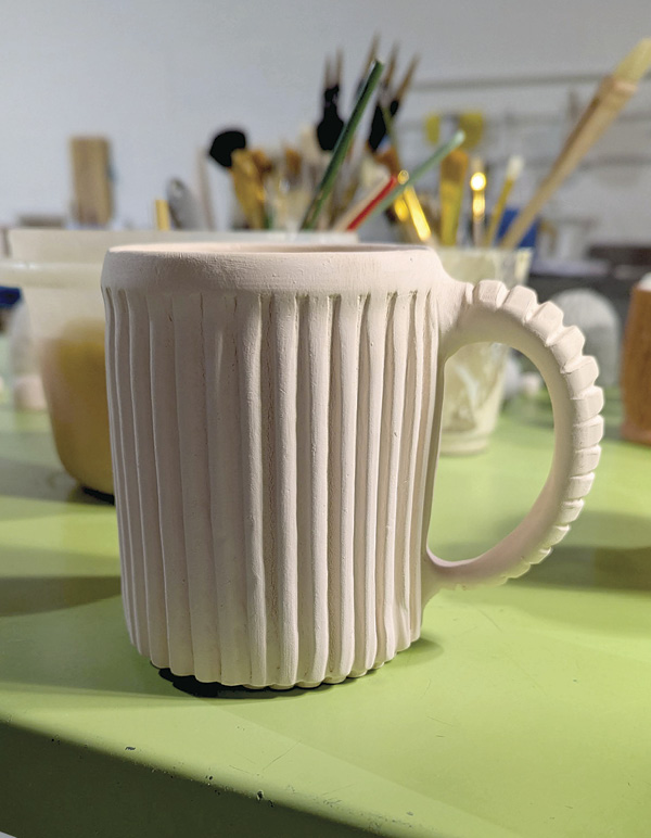 7 A handled mug made from the textured clay slab.