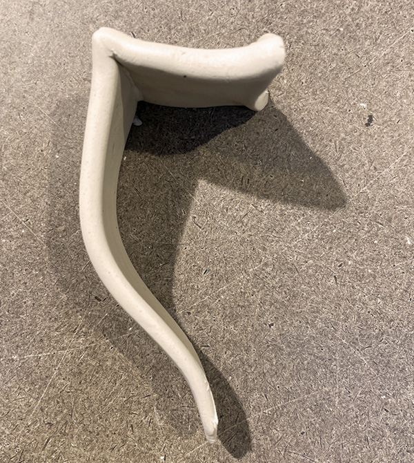 A6 Score the cuts, add slip, and reassemble the handle. Line up any texture.