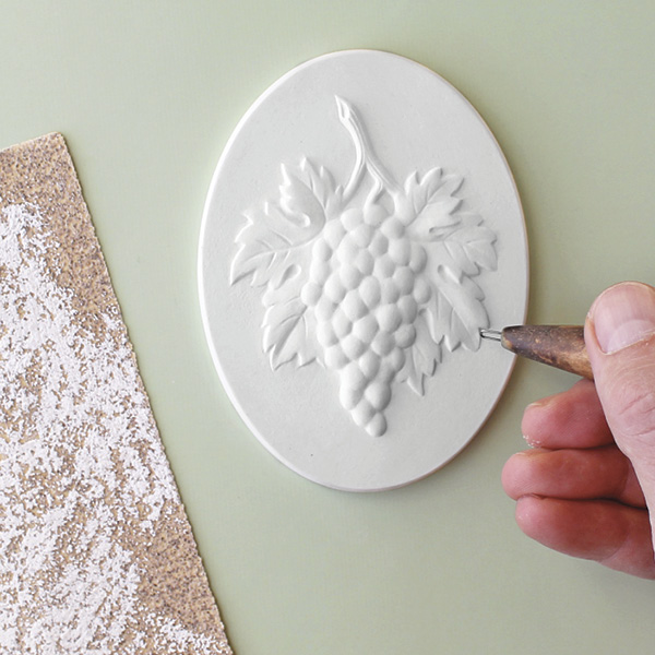 6 Smooth the dry medallion with sandpaper in a well-ventilated area.