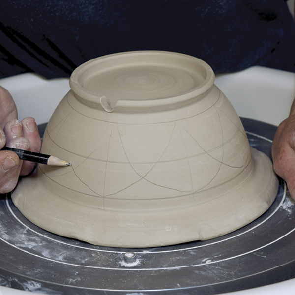 10 With the bowl centered upside down, draw lines for the holes.