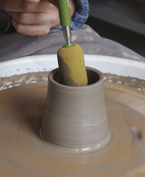 2 Using a sponge on a stick, soak up any excess water that has collected in the base of the form.