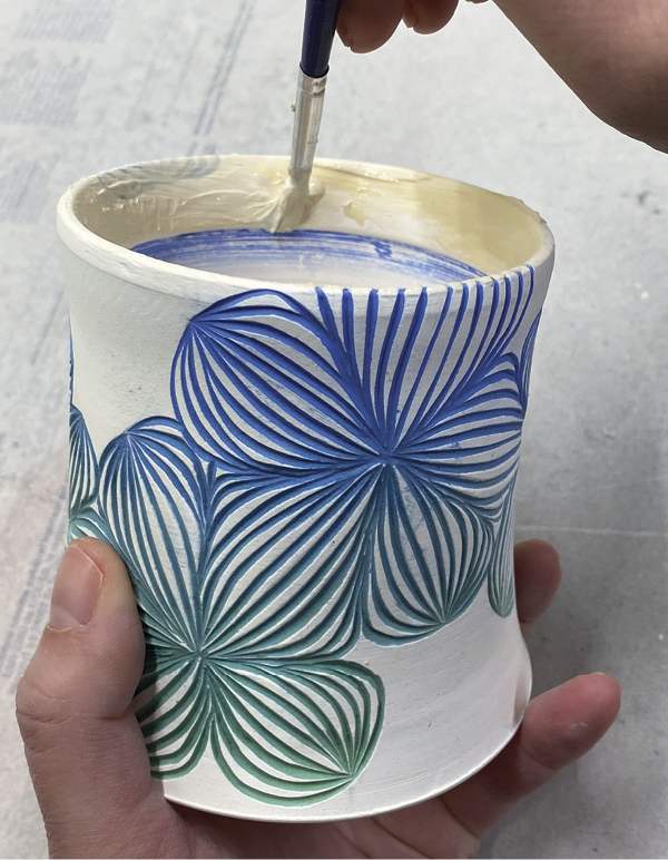 8 After bisque firing, apply latex resist to the interior rim.