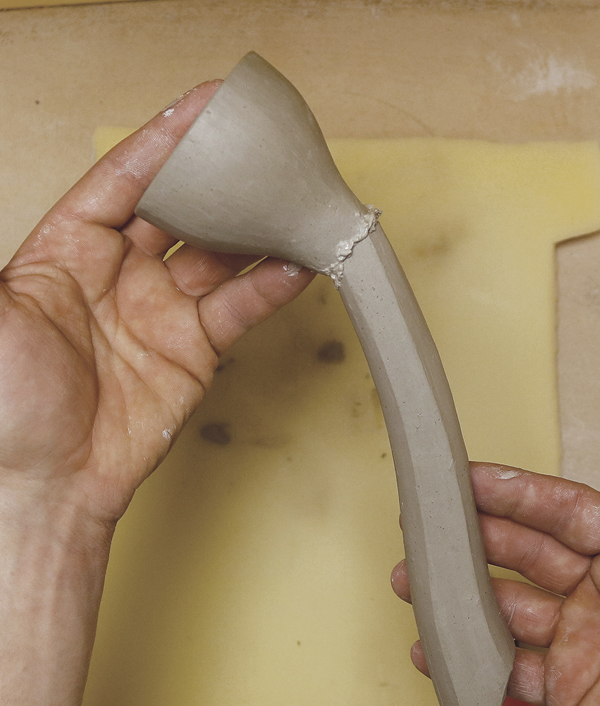 11 Score and slip both the spout and the bell, and then attach the two together securely. Refine the seam.