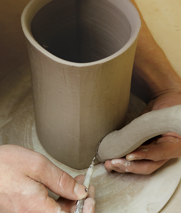 13 Trace where the spout will attach to the body, cut a hole at the mark, then attach the two forms.