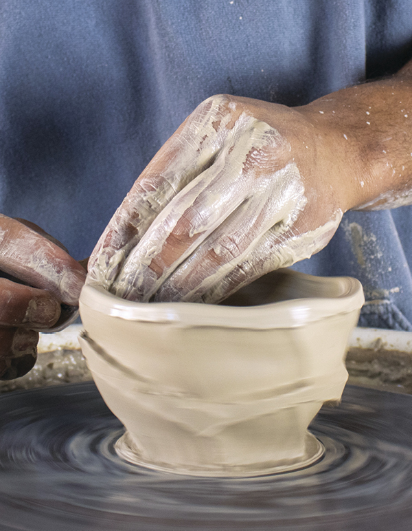 9 Smooth the lip with a chamois to finish the pot.