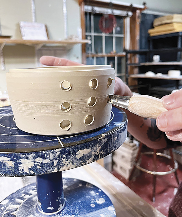 Wendy Werstlein altering her thrown form.