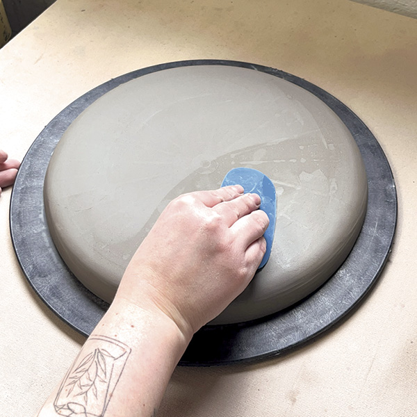 7 Gently pop the plate off the bat at leather hard and smooth the bottom.