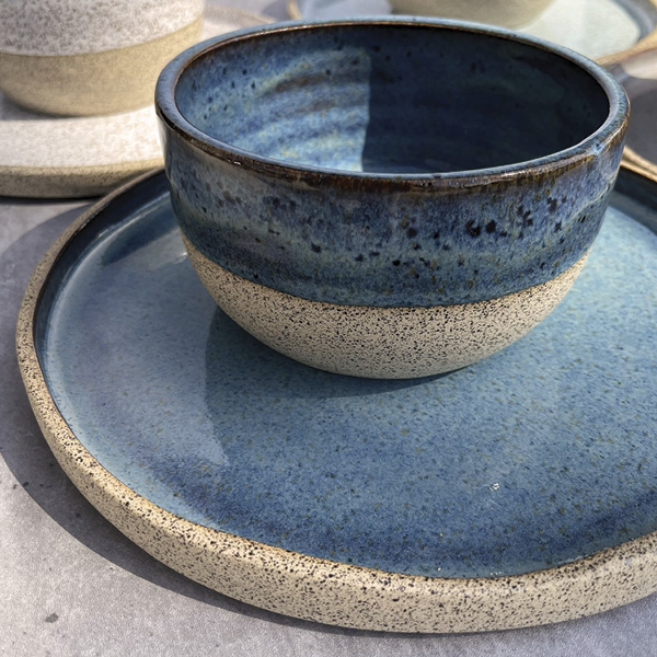 9 A finished plate and bowl set after being glazed and fired.