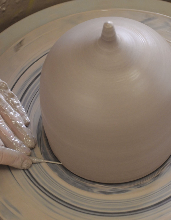6 Cut the pot from the bat, being careful not to warp the walls.