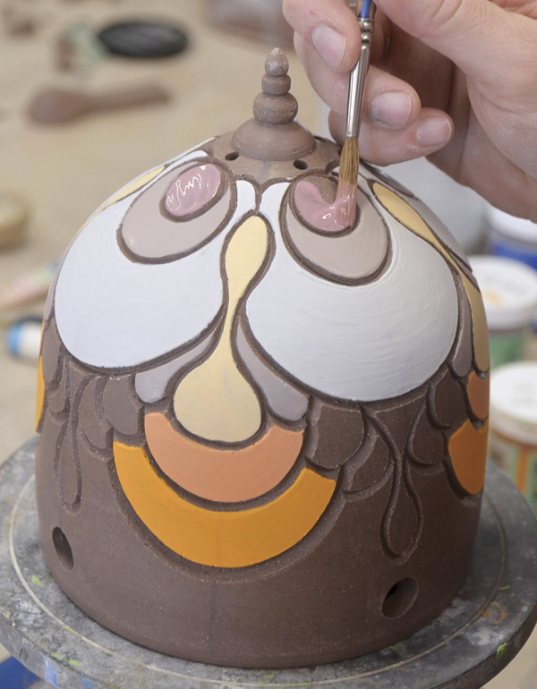16 Paint on two to three coats of underglaze or colored slip