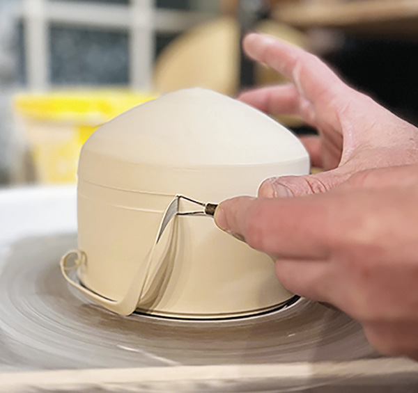 6 Use a narrow, straight-sided tool, trim the gallery and flange into the side wall.