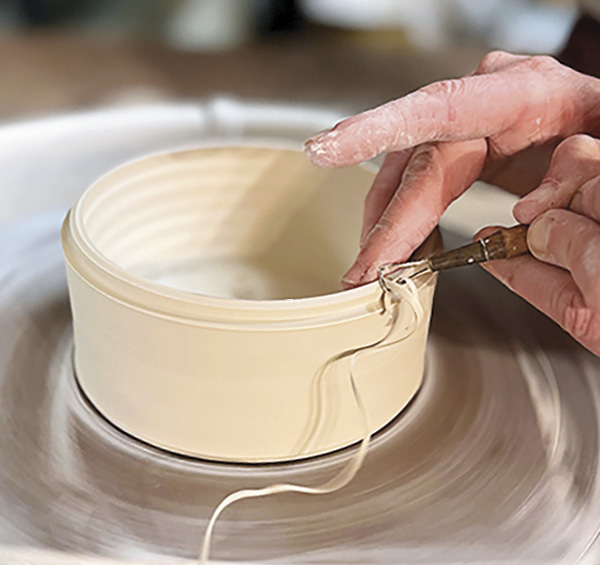 9 Remove the lid and trim the gallery on the bottom of the pot.