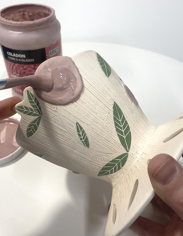 16 Paint each flower with colored glaze, and wax the before clear glazing the rest.