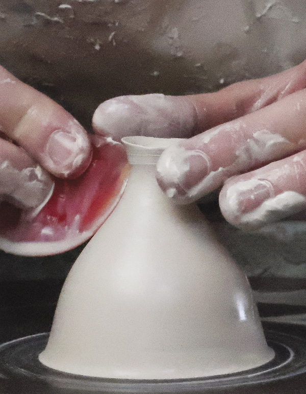 5 Pull the spout up, then out, then cone in the neck and flare out the top.