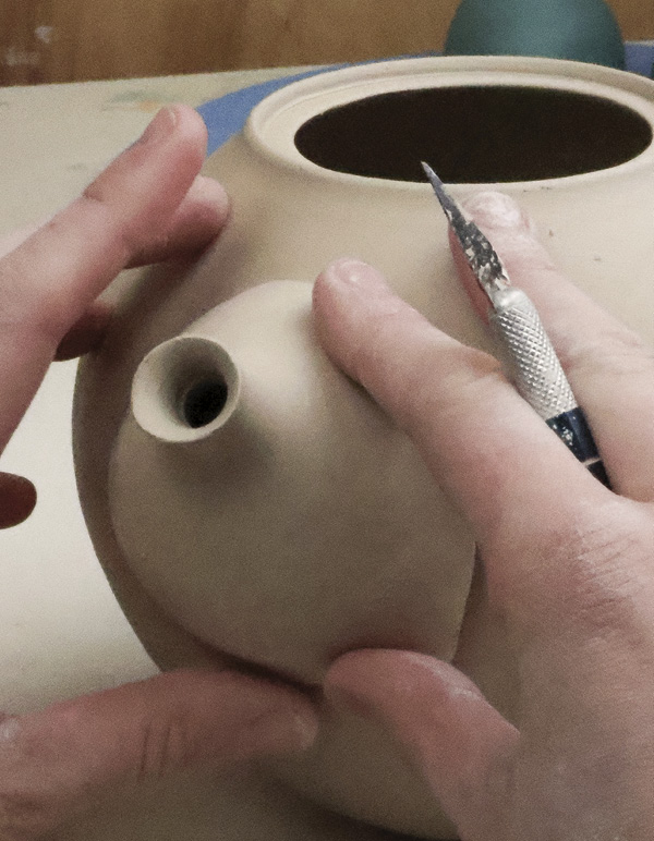 9 Alter the spout so it fits snuggly on the round profile of the body.