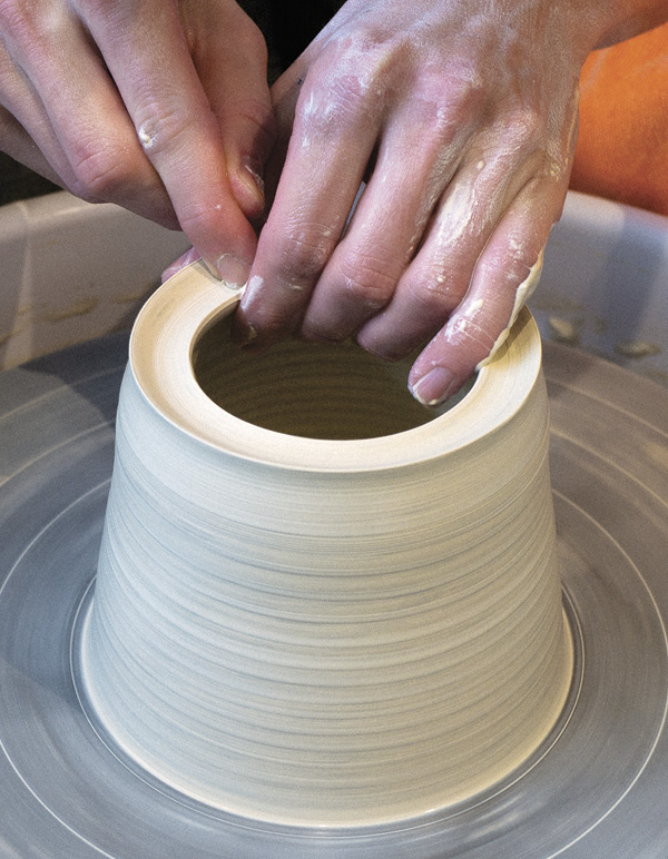 1 Keep walls angled inward. Press down at the midpoint of the thickened rim.