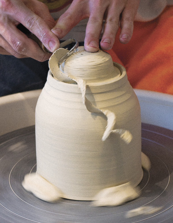 10 Use the teapot body as a chuck to trim the underside of the lid.