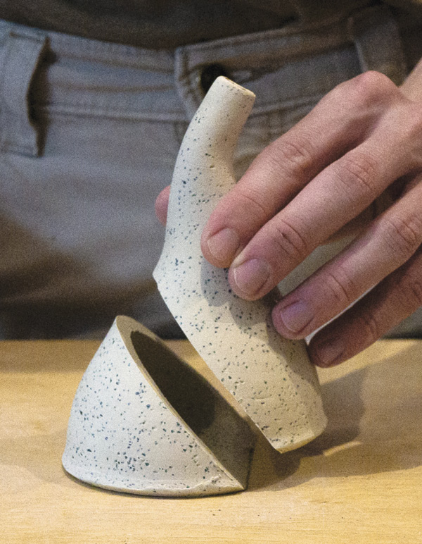 11 Cut the spout at an angle from halfway up on the top side down to the base.