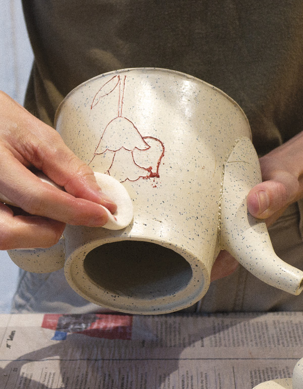 15 Wax, carve, and wipe away underglaze, leaving the color only in the incisions.