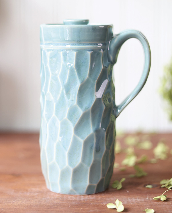 Dault Pottery's Faceted travel mug, 7 in. (17.8 cm) in height, light stoneware, robin’s egg blue glaze, 2024.