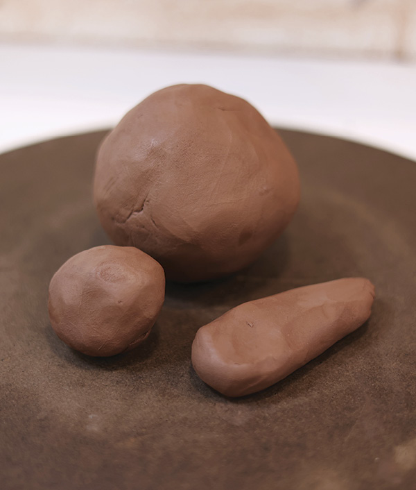 1 Prepare three balls of clay: A 2-pound ball for the body, a 4-ounce ball for the lid, and a 3-ounce ball for the handle.