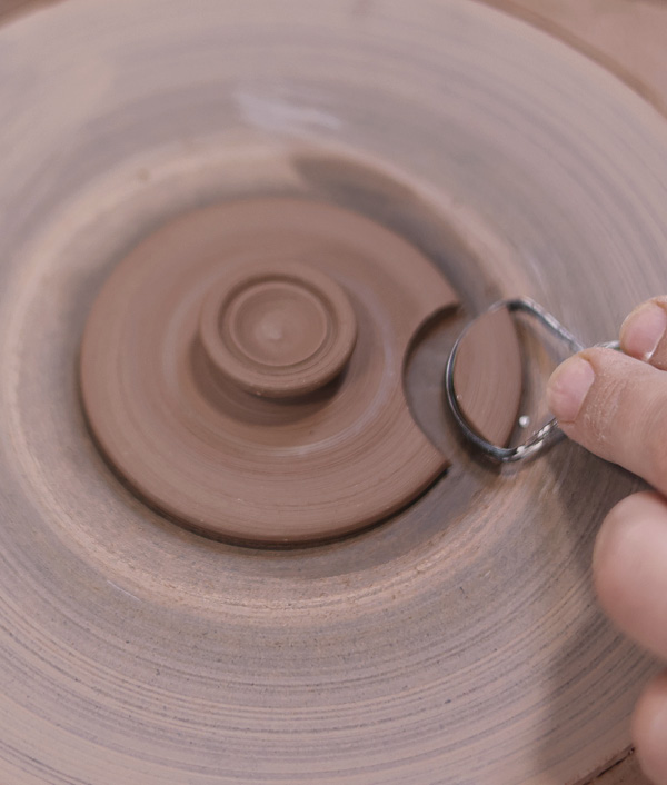 11 Before removing the lid from the bat, use a round trimming tool to cut out a drinking notch.