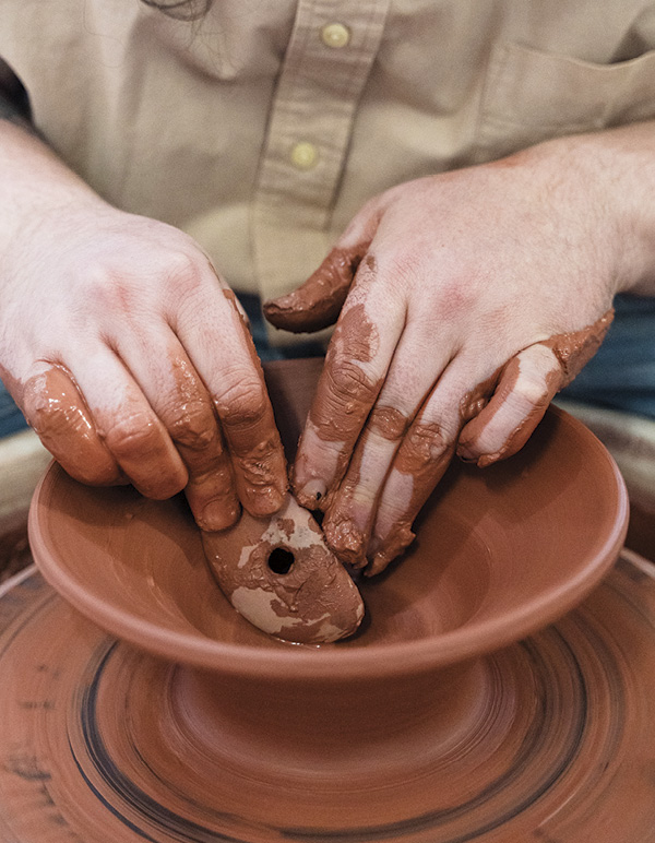 3 Using a wooden kidney rib, define the curve of the bowl’s interior.