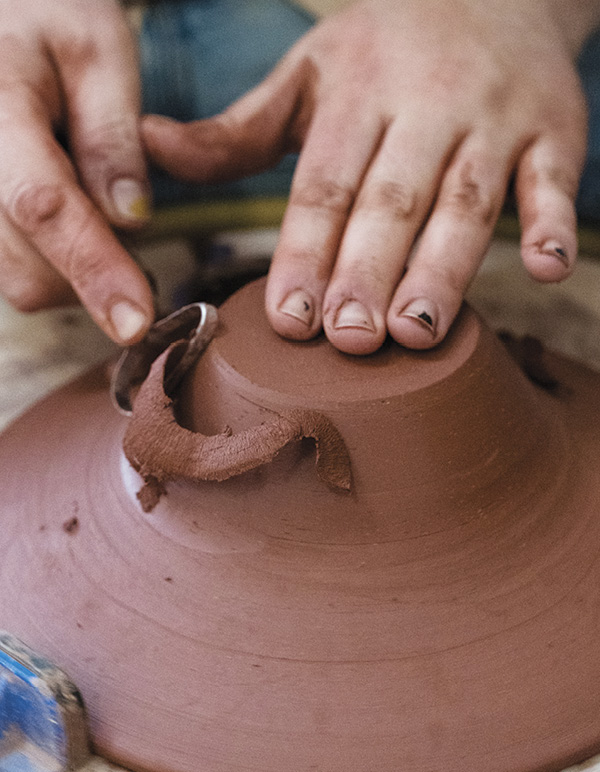 4 Trim away excess clay and trim the outer edge to establish a foot.