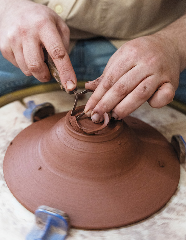 6 Trim the center. Rock the loop tool from foot to center following the bowl’s curve.