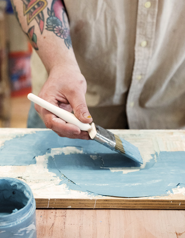 3 Brush wet slip over your dried drawings. Allow them to dry to leather hard.