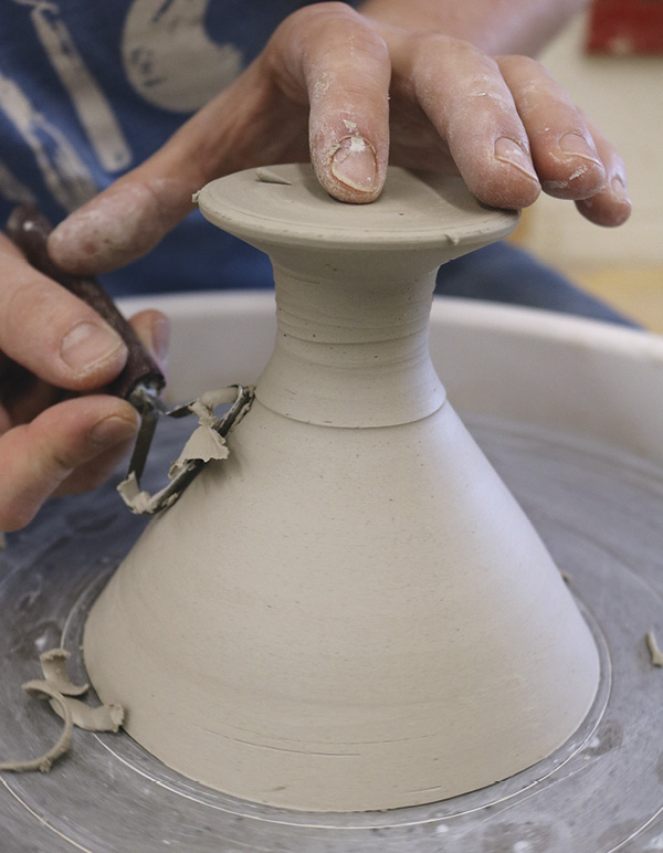7 Remove the bulk of the clay on the underside of the foot and stem.