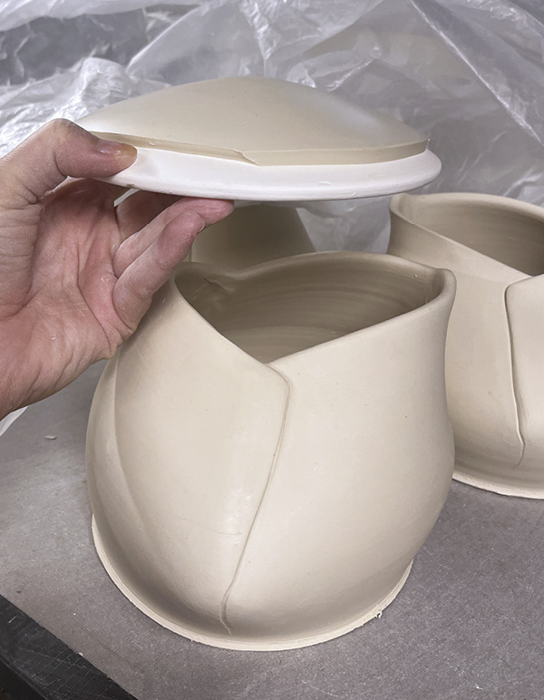 4 Form the lid slab on a hump mold, then shape until it fits inside the rim.