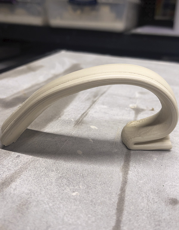 13 Pull a long strap of clay. Double it over itself to create a vertical seam.