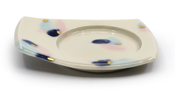 Samantha Hostert's Snack Saucer, 51/2 in. (14 cm) in length, porcelain, glaze fired to cone 6, luster fired to cone 018, 2024.
