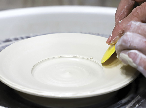 3 Use a rib to lay down the sides to almost parallel with the wheel.