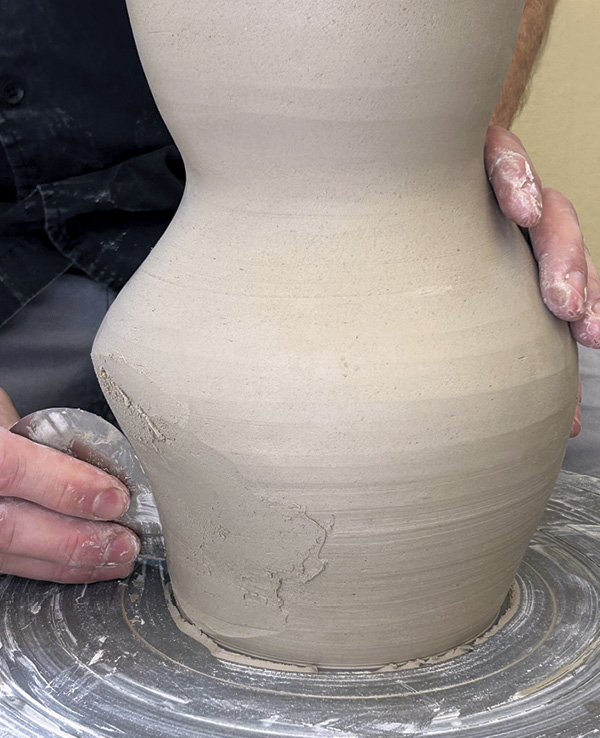 5 Move side to side and up and down to bend the wall inward with a metal rib.
