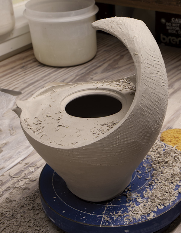16 Refine the final form, handle, and lip by thinning them with a Surform.