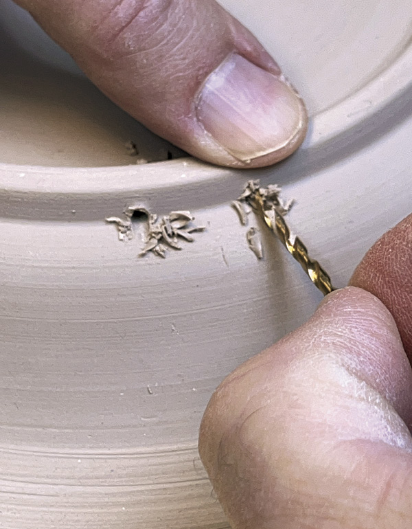 24 Use a 1/16 drill bit to create holes in the foot for a hanging wire.