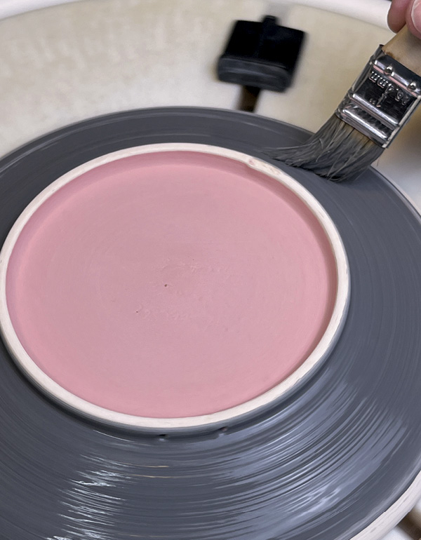 30 Invert and center the plate, then brush glaze into the center, then over the rim.