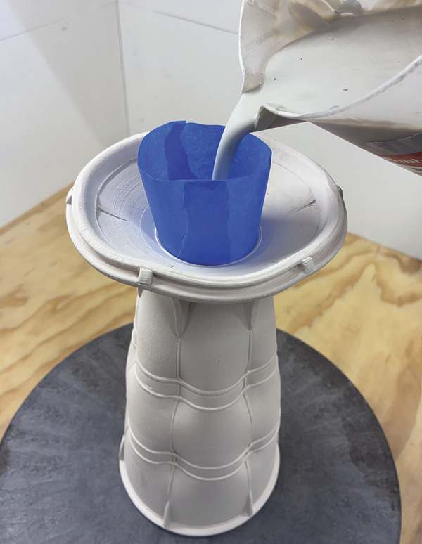 16 Bisque fire. Use blue painters’ tape as a linear resist when applying a liner glaze.